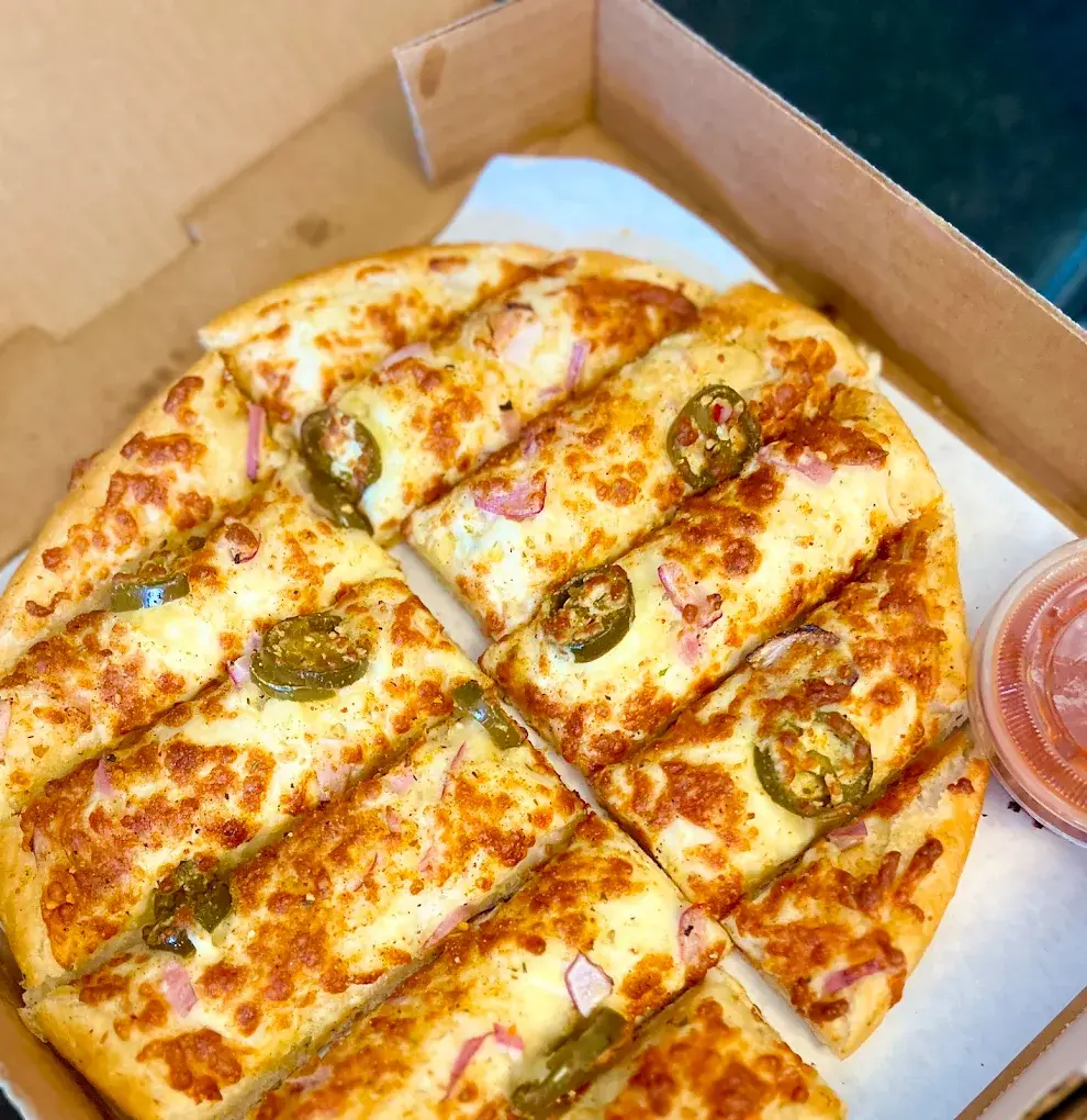 Boss Pizza signature dishes - Indian-inspired and traditional pizzas