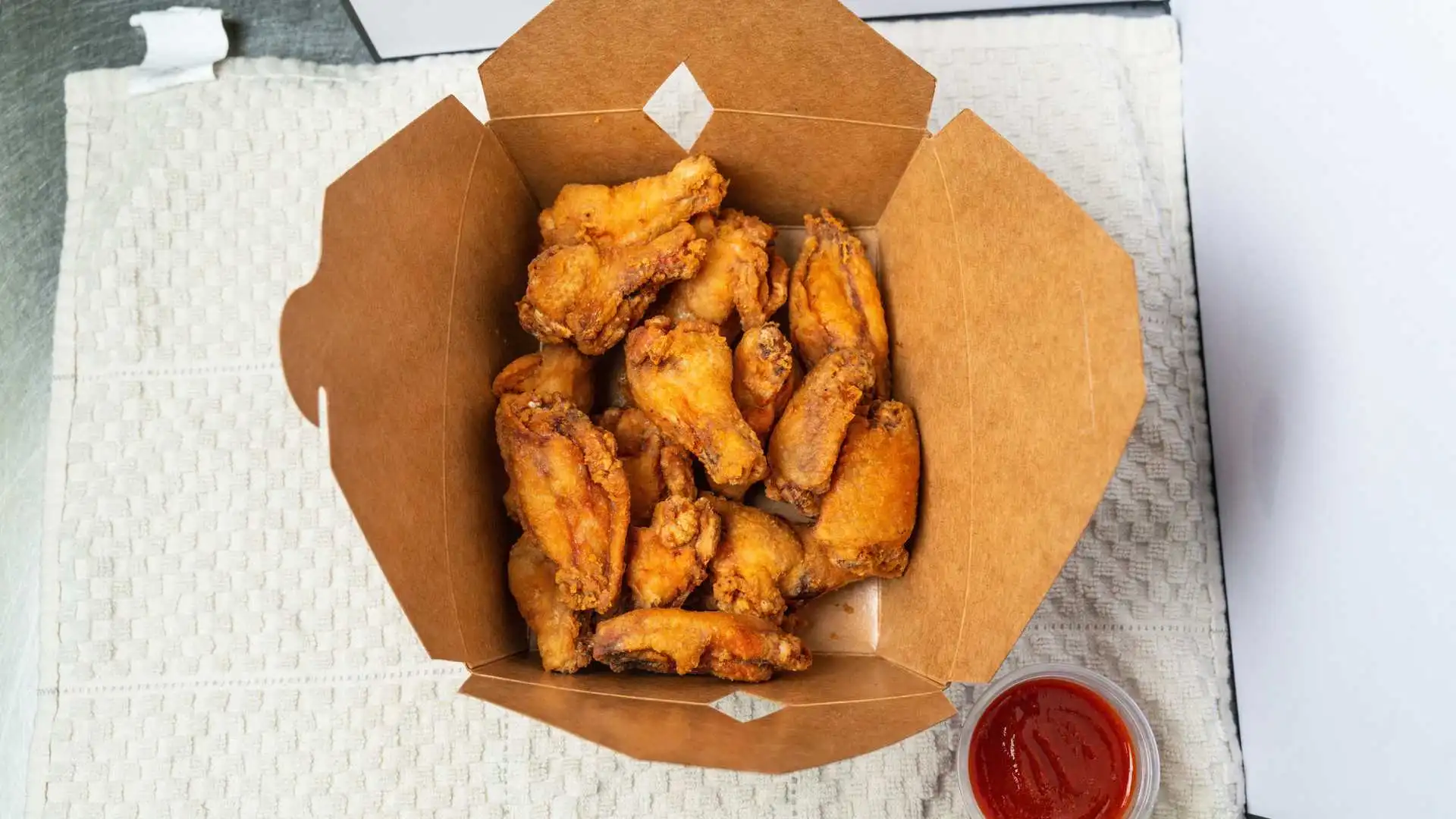 Butter Chicken Poutine and halal wings at Boss Pizza Edmonton